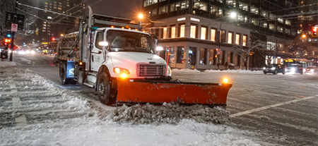Snow removal on a city street