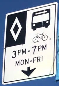 bus lane sign allowing cyclists