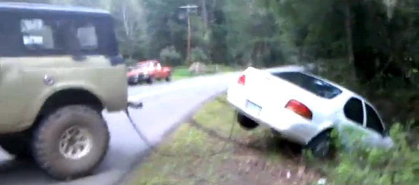 image of pulling a vehicle out of the ditch