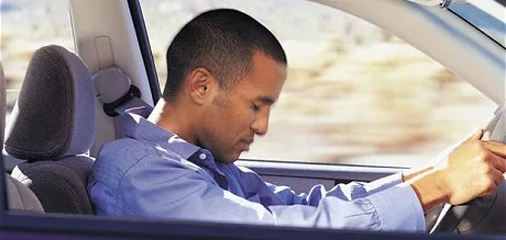 image of driver falling asleep at the wheel