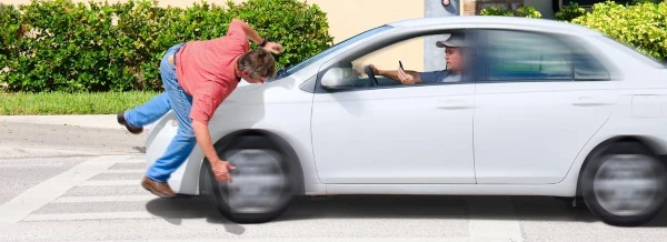 image of pedestrian being hit by a car
