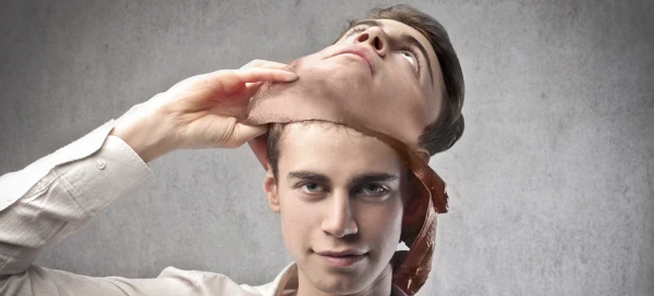 image of someone impersonating another using a mask