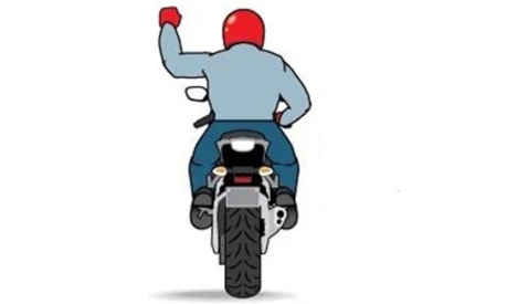image of motorcycle rider signaling right turn