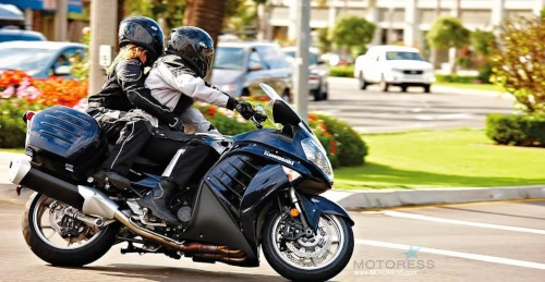 riders and passengers lean together for a safe ride image