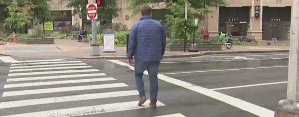 image of a pedestrian entering a crosswalk
