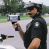 image of motorcycle officer using radar