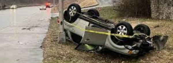 image of yellow ribbon on overturned car