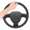 an illustration showing a left hand properly positioned on the steering wheel when the driver is backing up