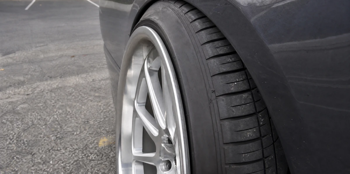 Car tire stretched beyond the wheel manufacturer's approved rim-width range