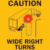 caution wide right turns sign for display on the rear of a long commercial vehicle